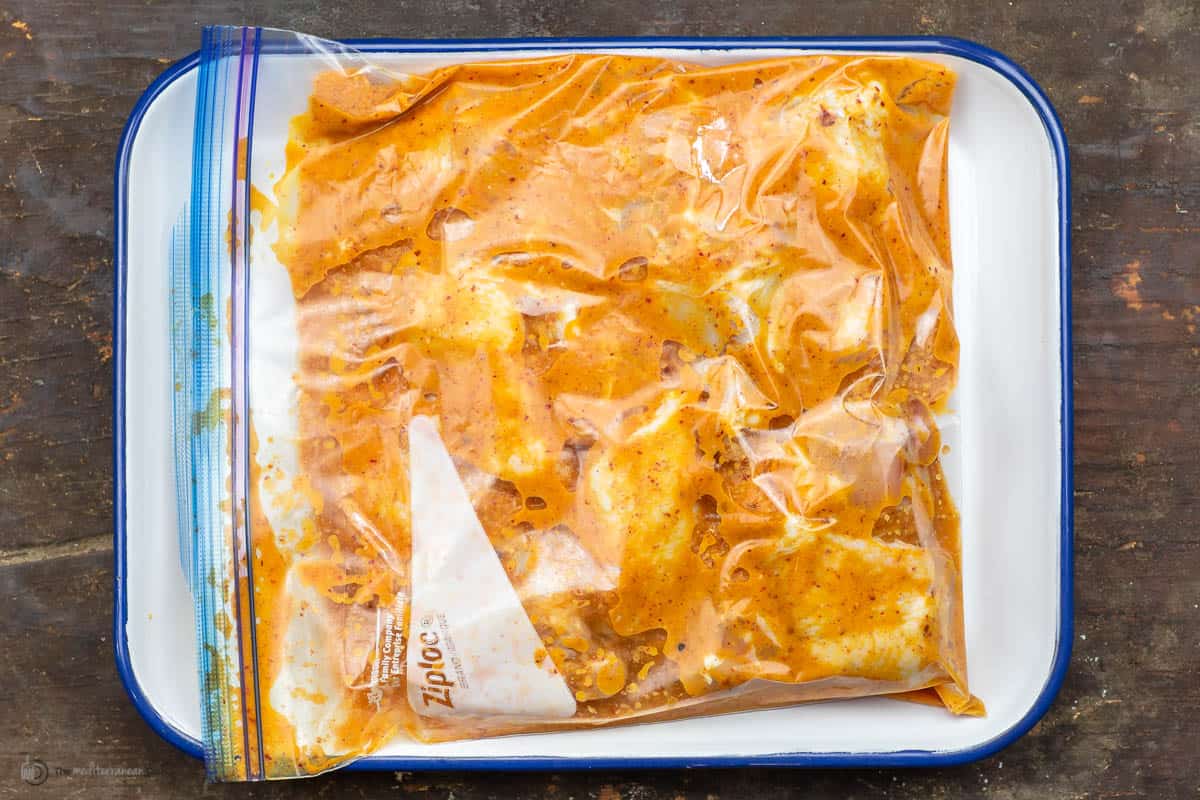 Chicken wings marinating in a ziploc bag