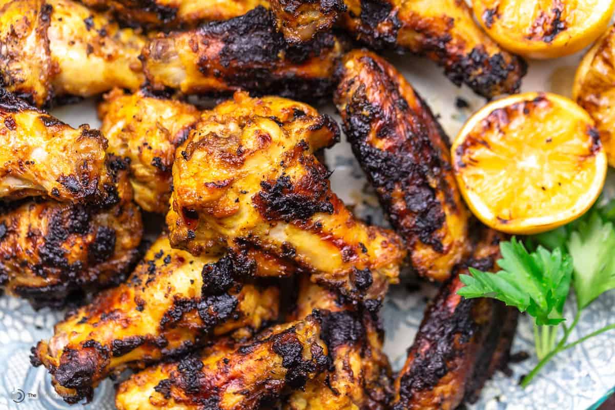 A close-up of grilled chicken wings