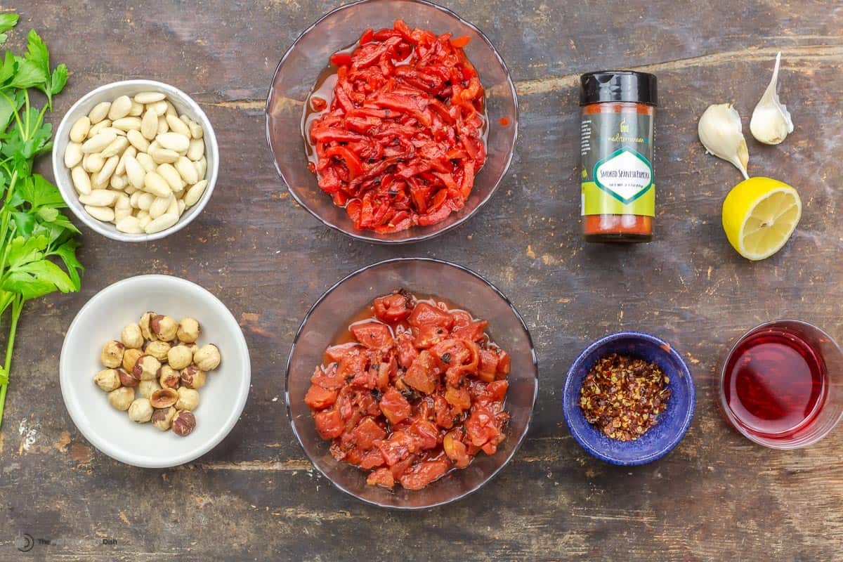 ingredients needed to make romesco sauce measured into small bowls