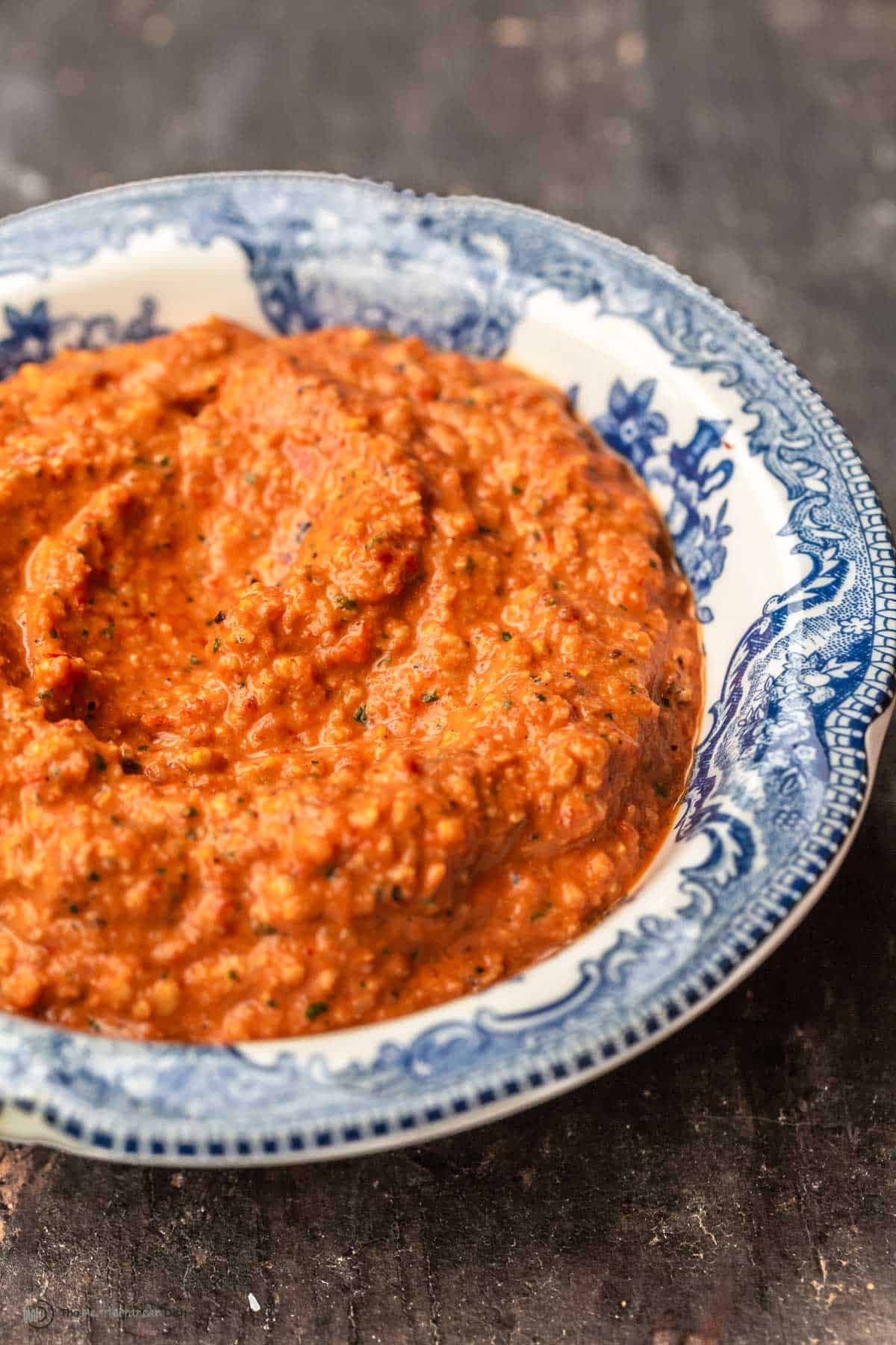 Roasted red pepper and fire roasted tomato sauce in a blue and white bowl