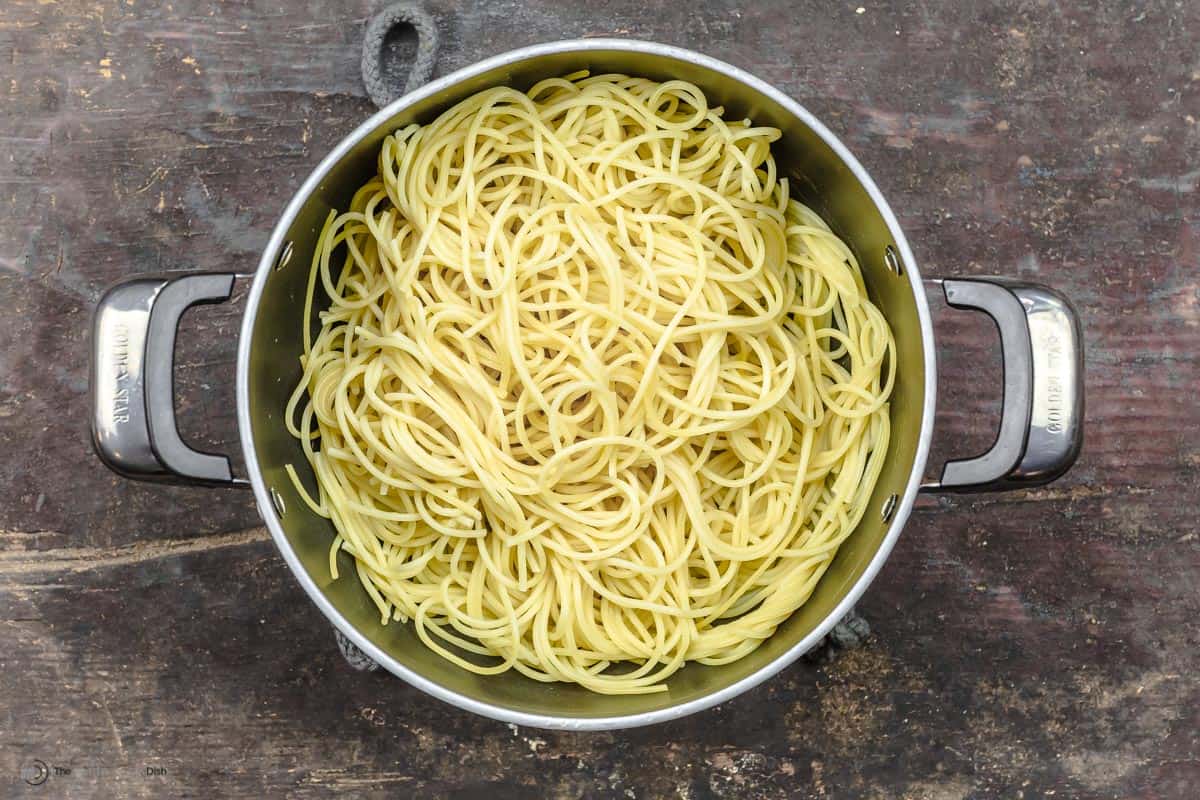 Drained spaghetti noodles in a large pot