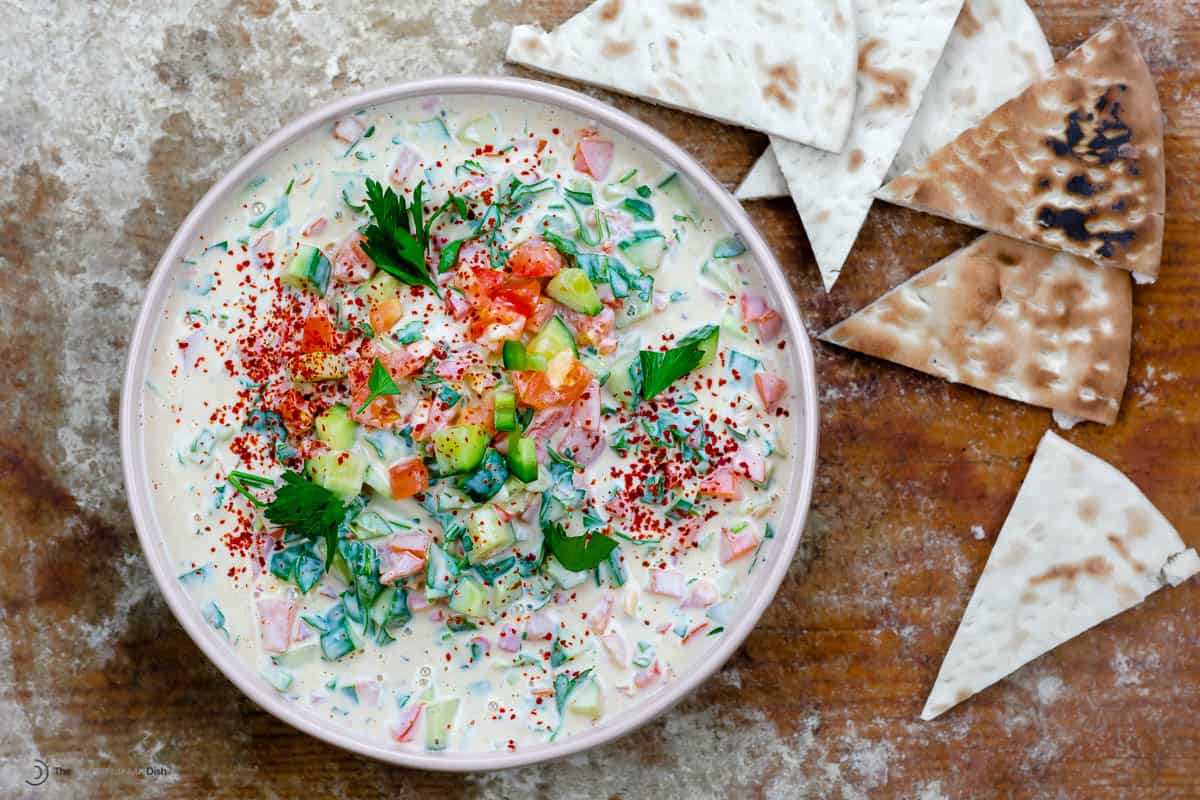 A bowl of Middle Eastern tahini salad with homemade pita chips