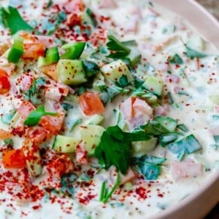 Tahini salad with cucumbers, tomatoes, parsley and aleppo pepper
