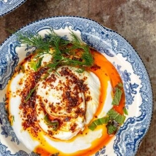 Cilbir Turkish Eggs in a blue dish