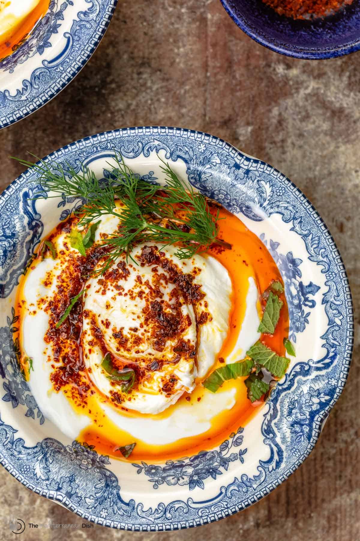 Cilbir Turkish Eggs in a blue dish