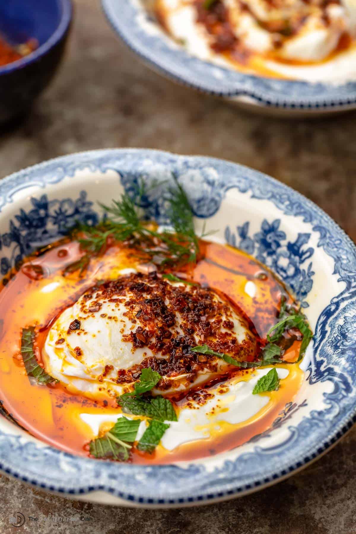 Turkish eggs in a blue and white dish
