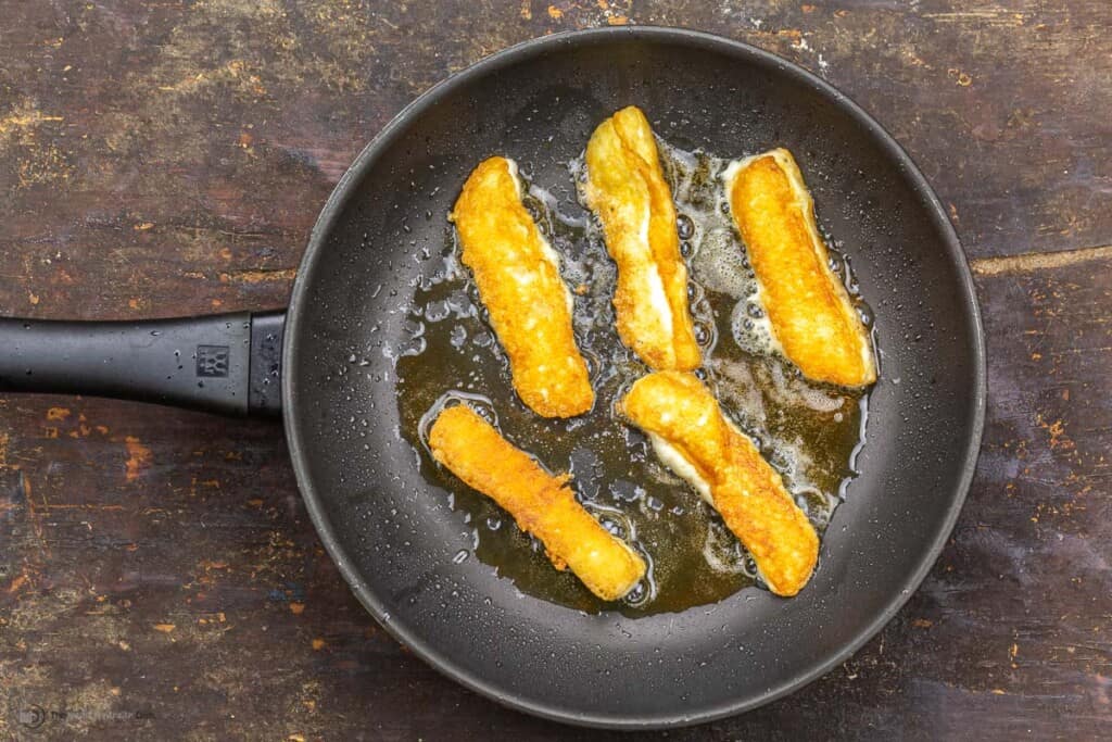 Halloumi fries in a skillet