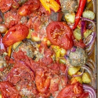 Baked meatballs with vegetables and tomatoes
