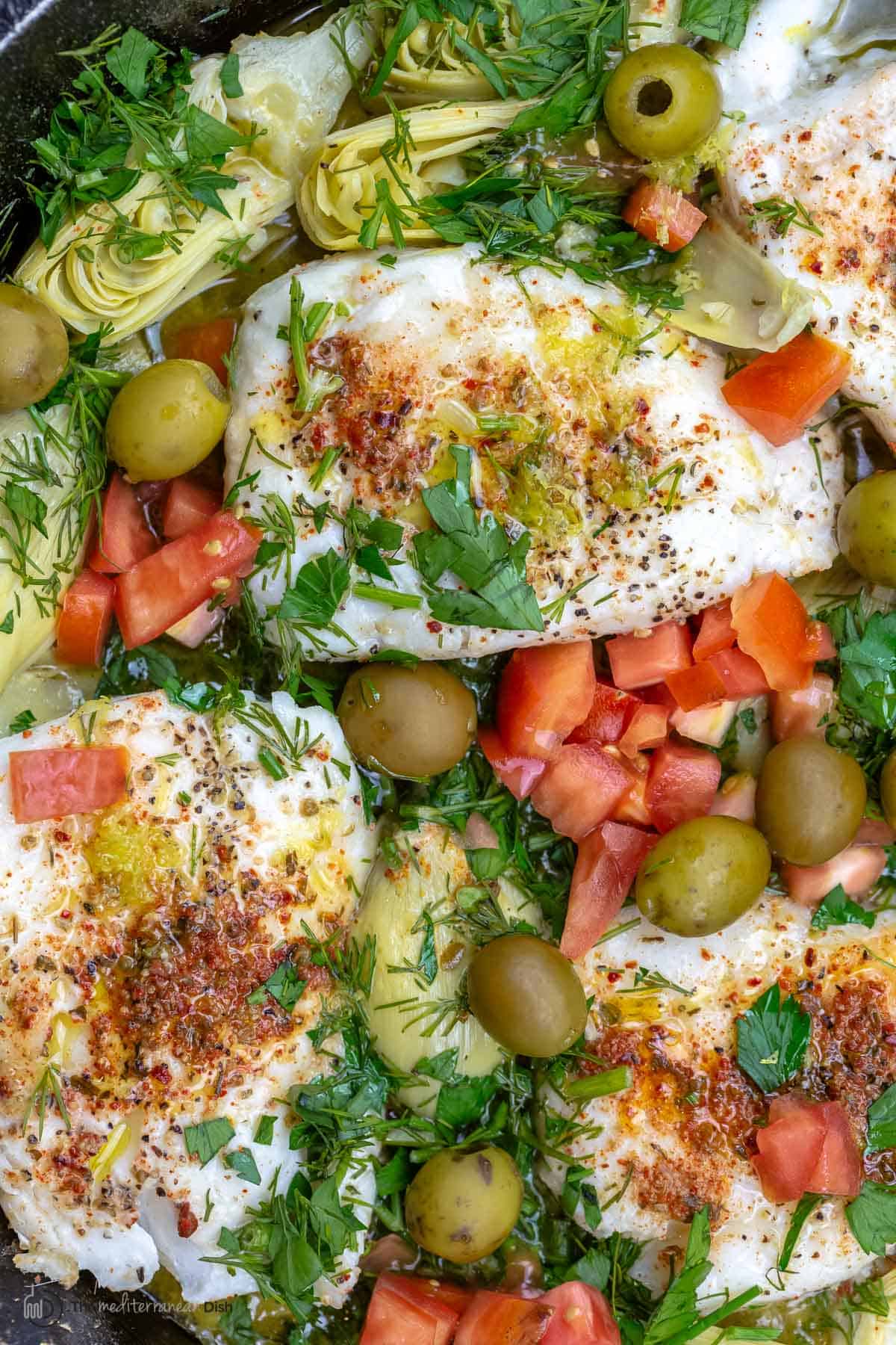 Close-up of lemon haddock recipe with artichoke hearts