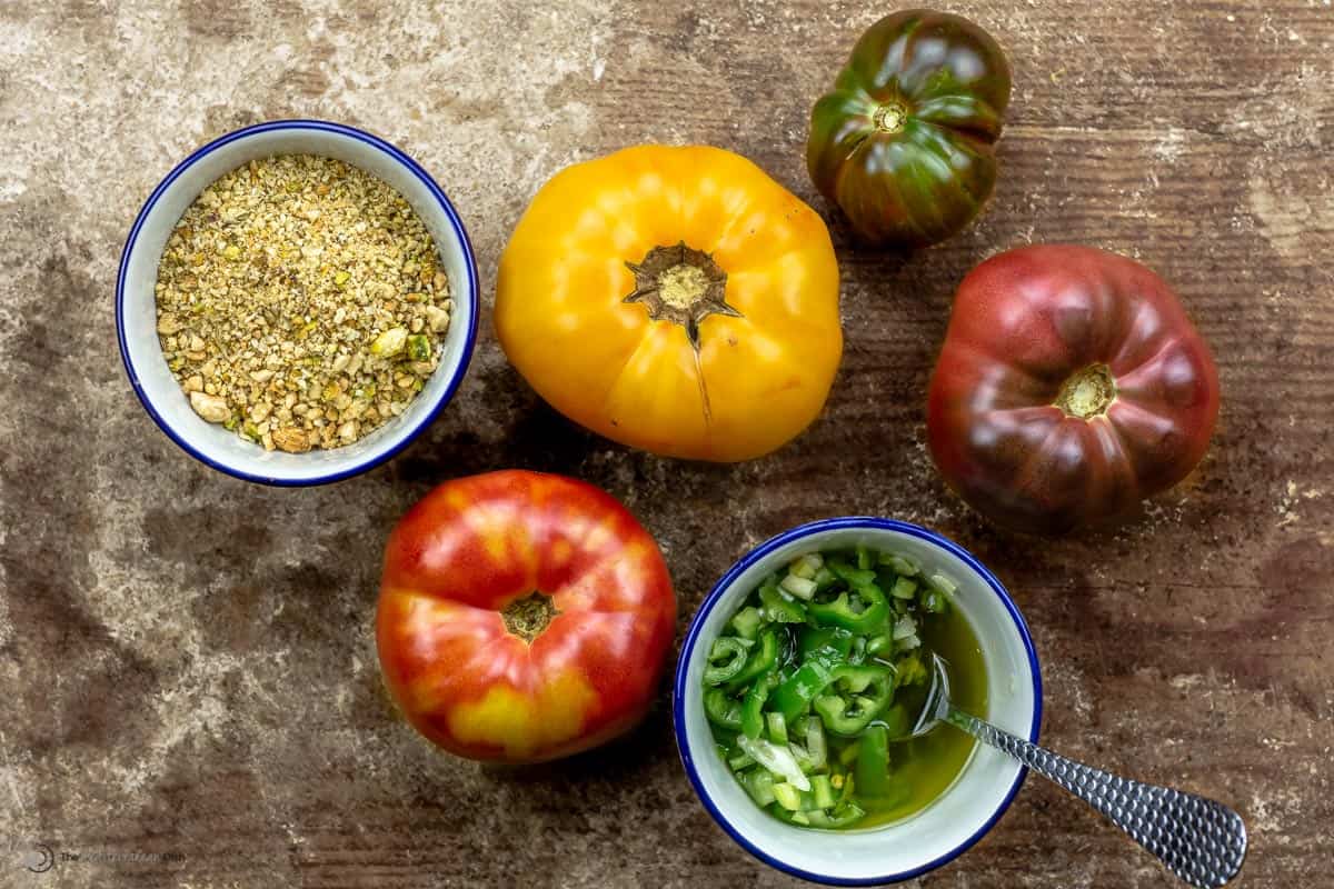 whole heirloom tomatoes with a side of dukkah nuts and jalapeno peppers