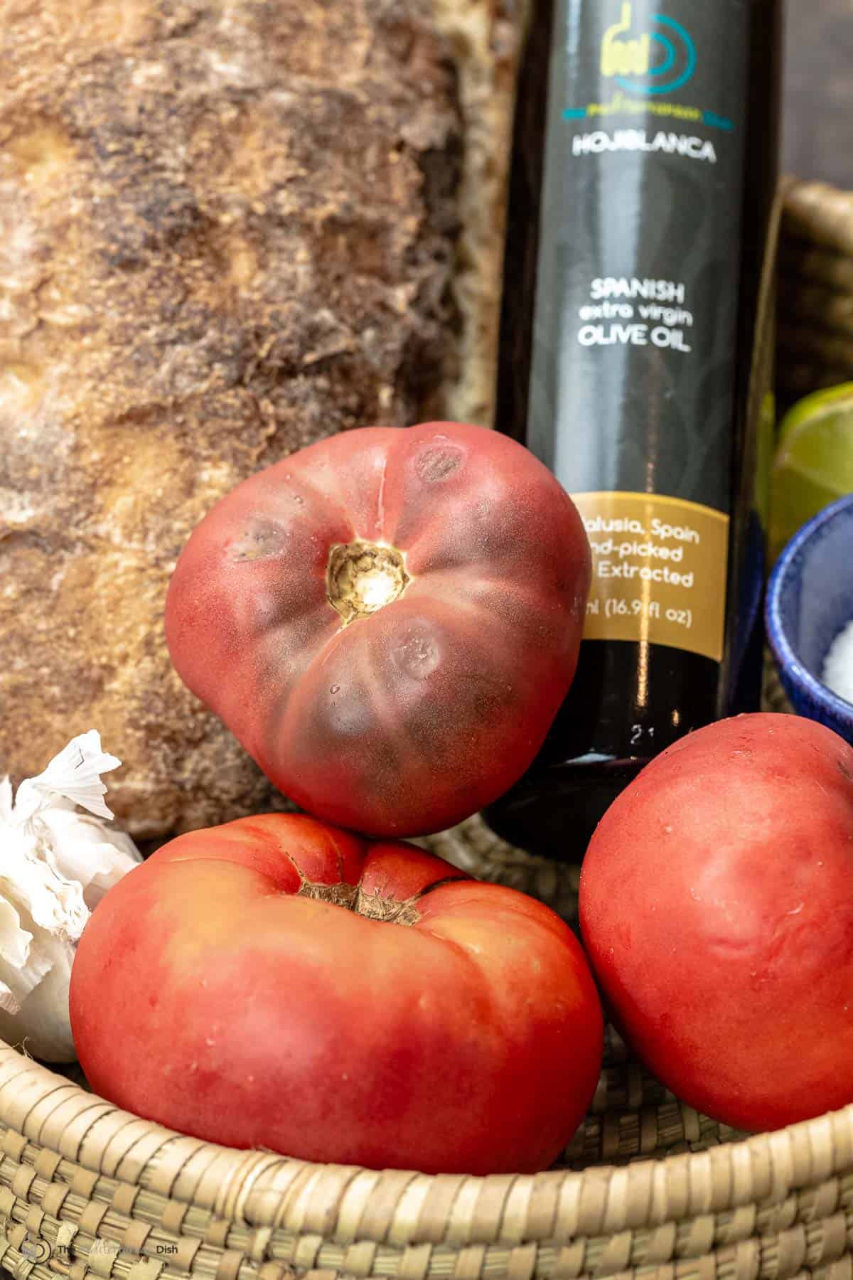 Ciabatta bread, tomatoes, olive oil and garlic in a basket