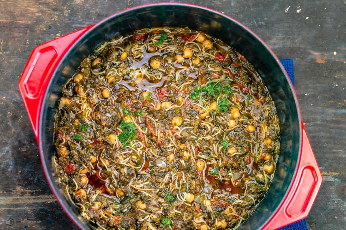 A big red pot of vegan spinach stew