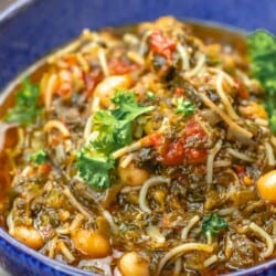 A blue bowl of Mediterranean spinach stew
