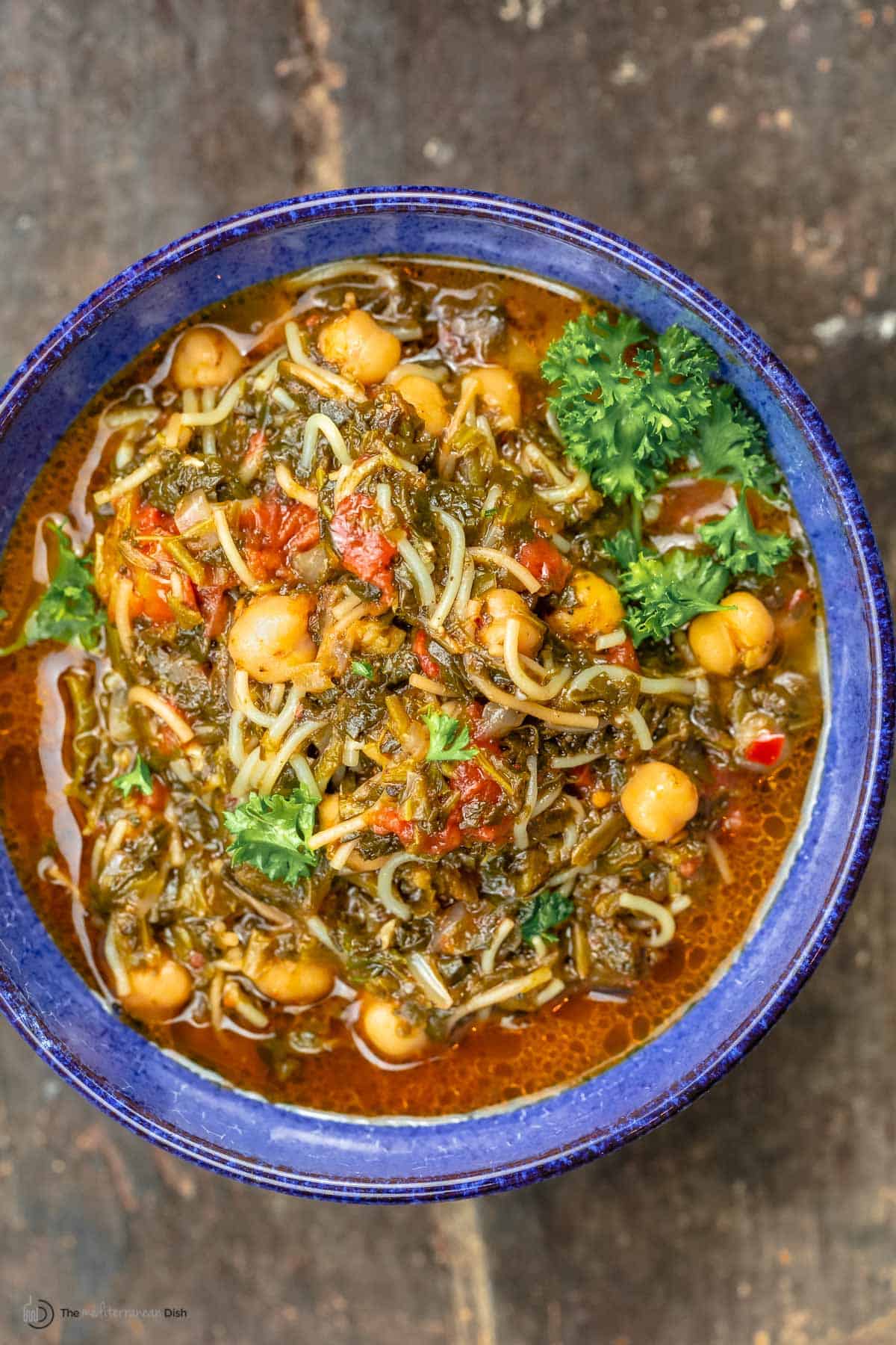 A bowl of vegan Mediterranean spinach stew