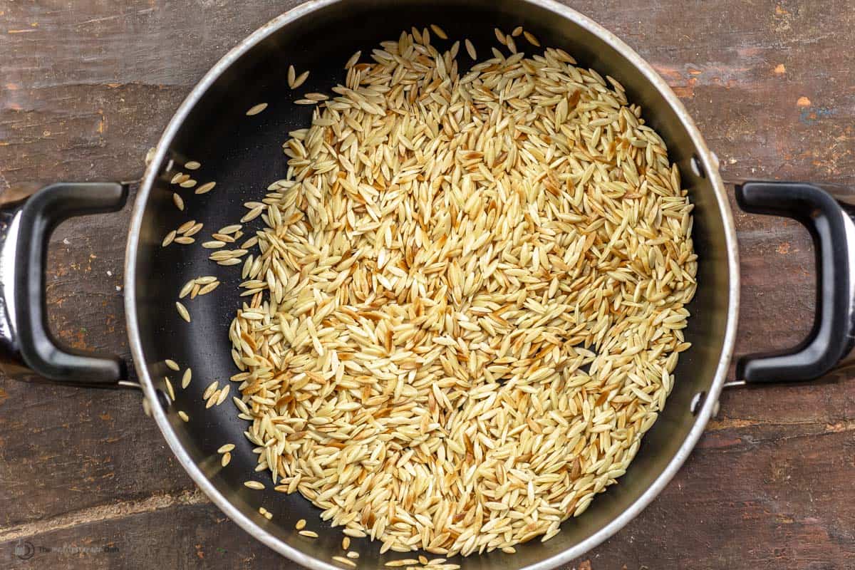 Toasted orzo in a pan