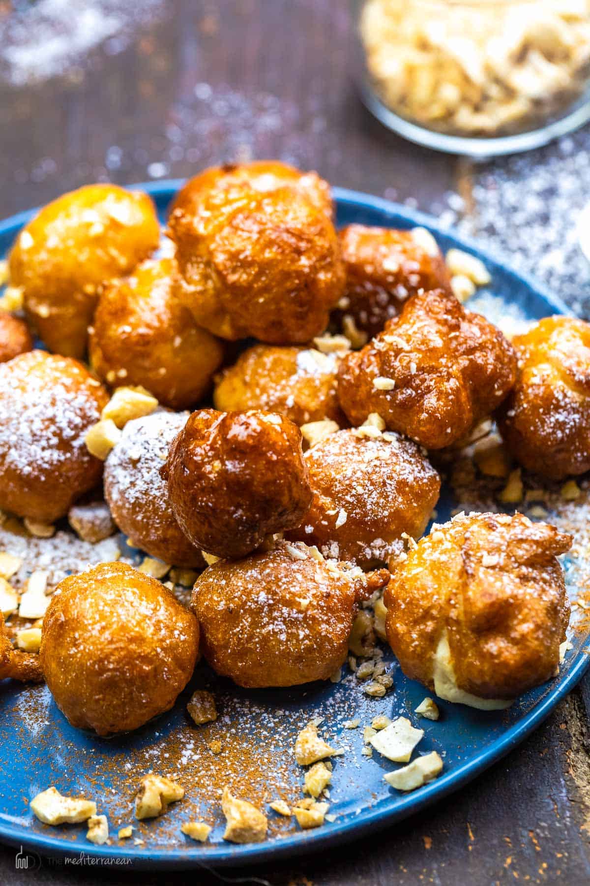 Greek donuts with topped topped with crushed nuts