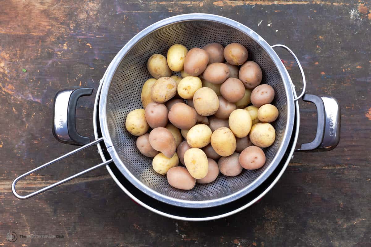 Baby potatoes in a metal strainer