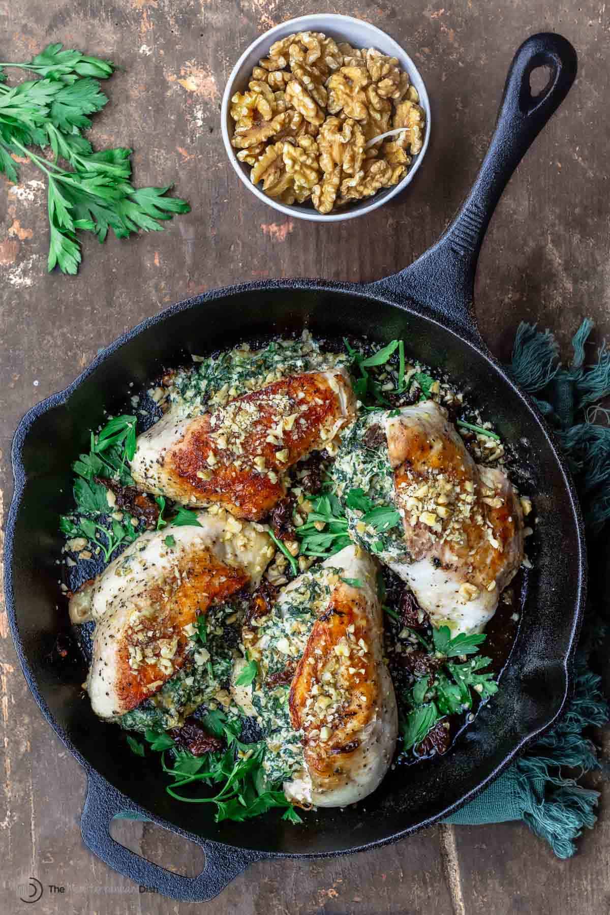 stuffed chicken breasts with a side of walnuts