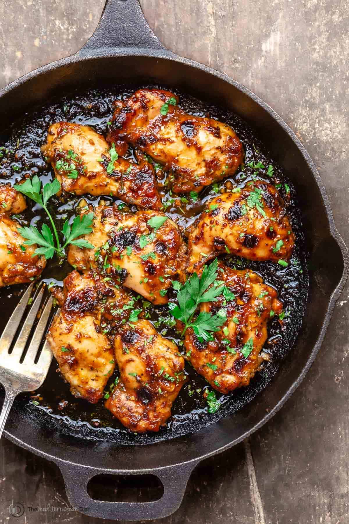 baked balsamic chicken in a cast iron skillet