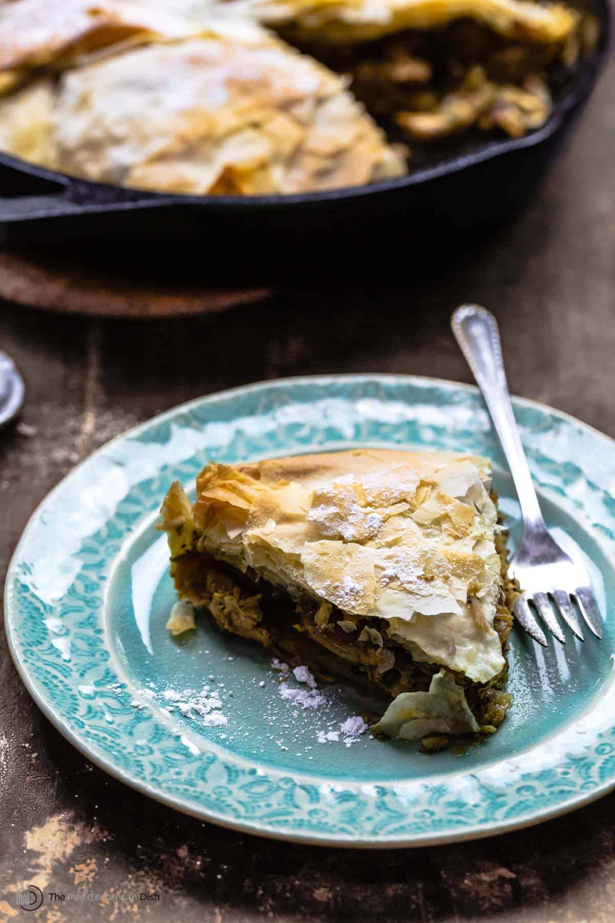 slice of pastilla on a plate with a fork