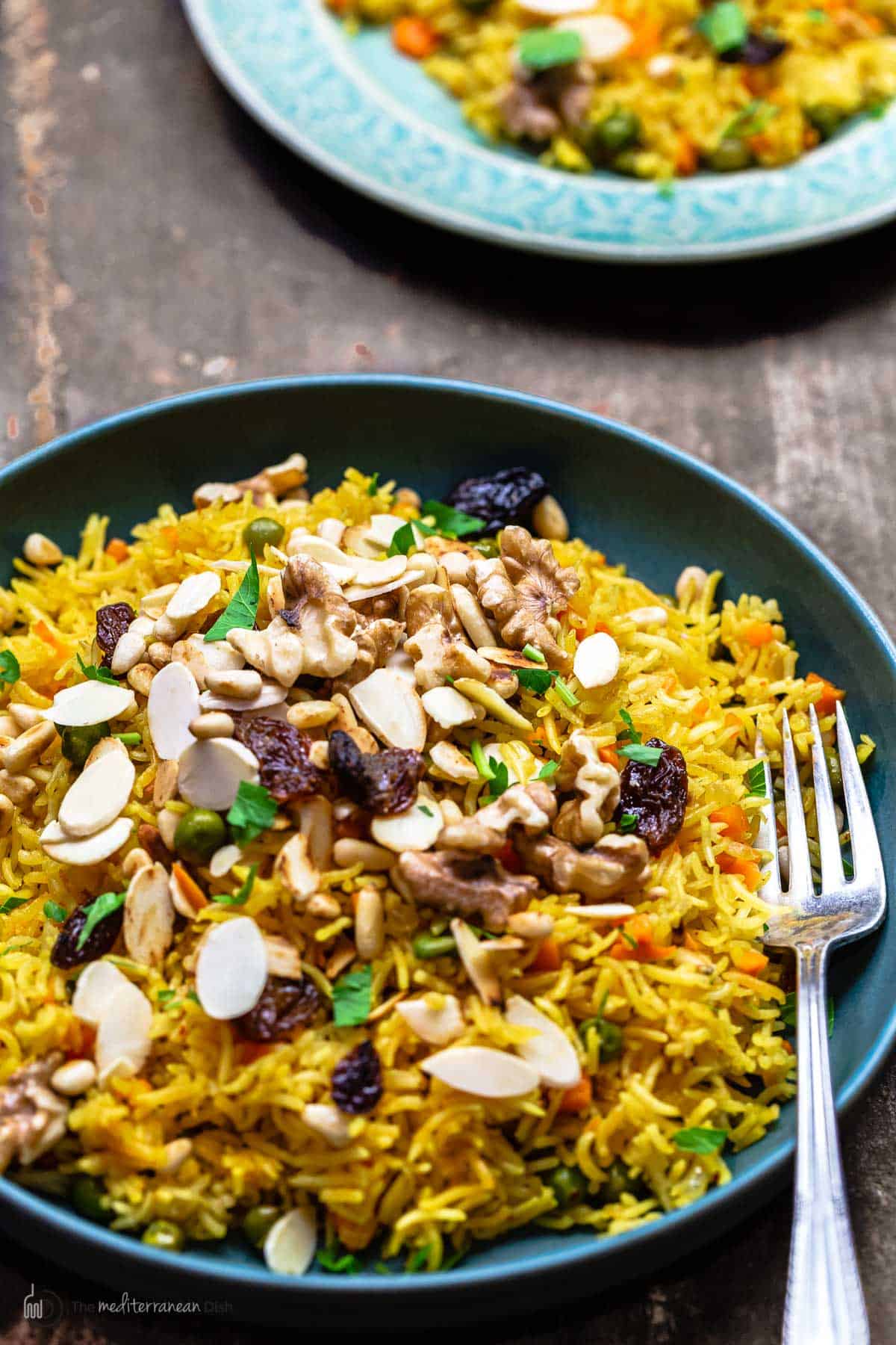 rice pilaf topped with dried fruit and toasted nuts