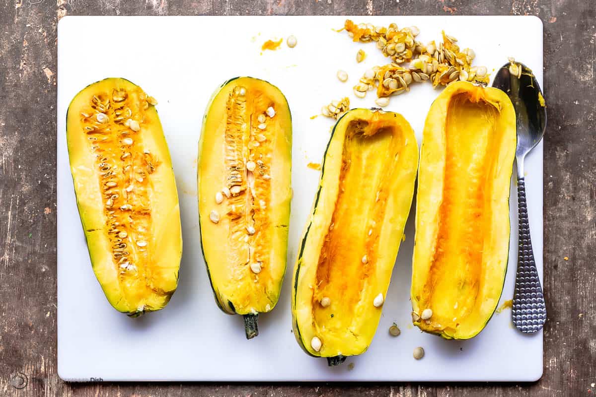halved delicata squash, some with seeds, some without