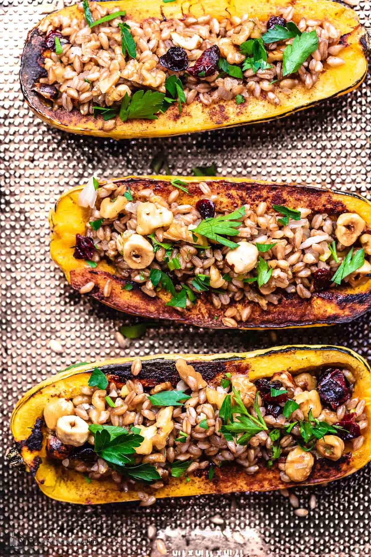 roasted delicata squash stuffed with farro, nuts, and dried fruit