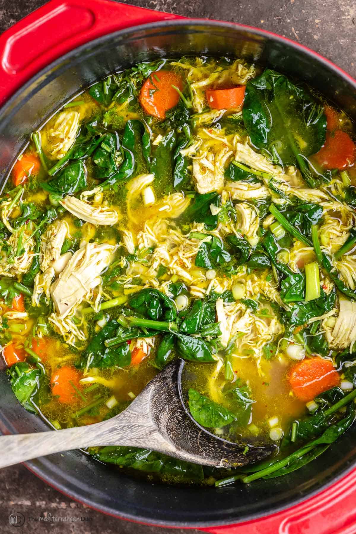 turmeric lemon chicken soup in a pot