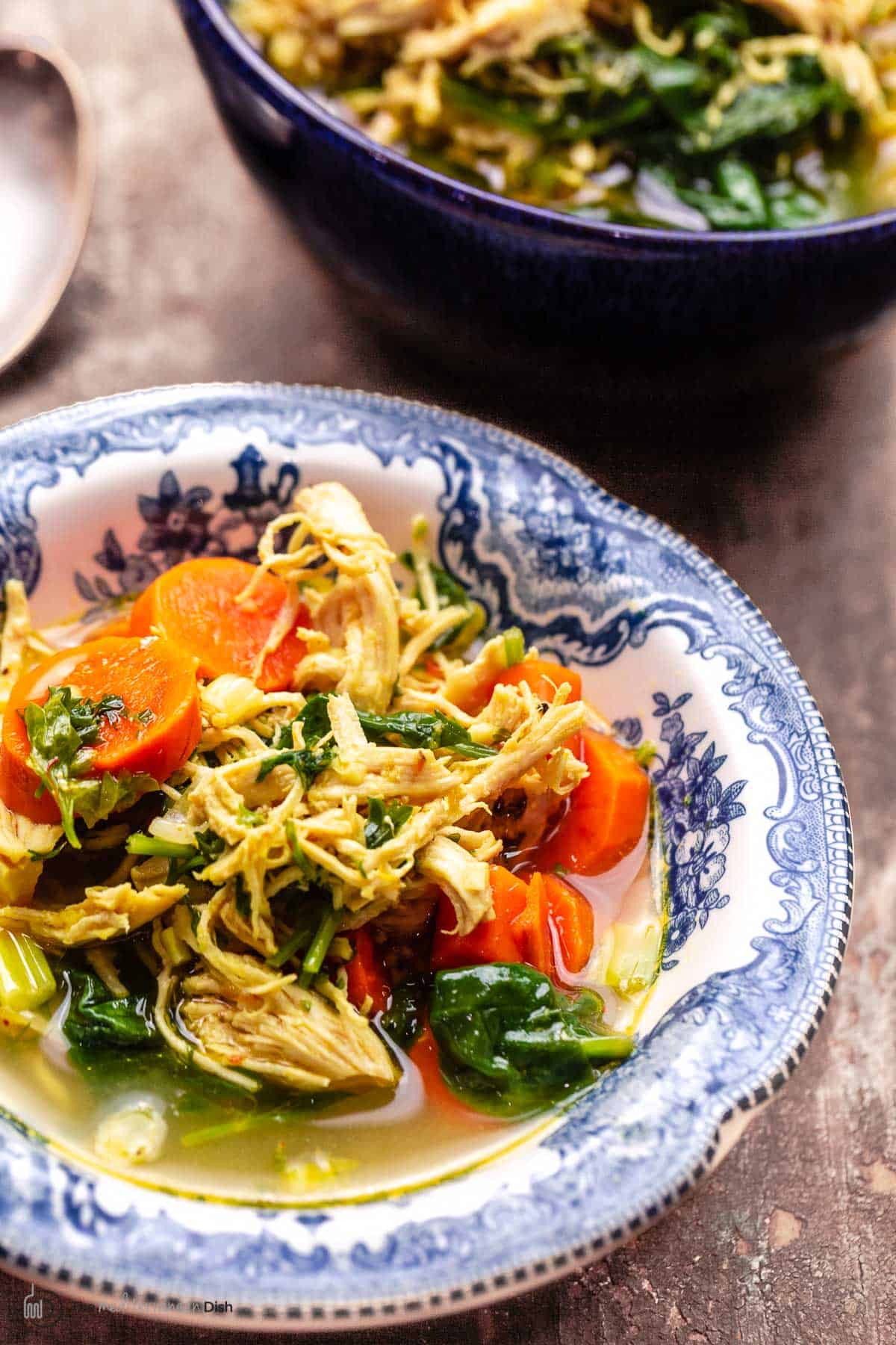 chicken soup with lemon and turmeric in a bowl