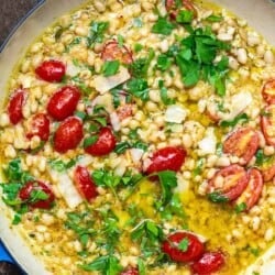 garlic parmesan white beans with cherry tomatoes in a pot