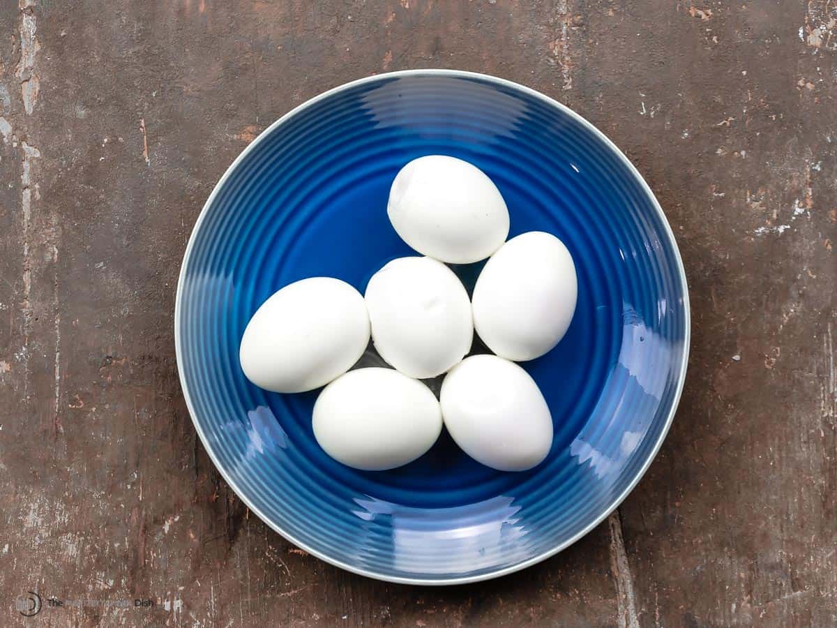 hard boiled eggs on a blue plate