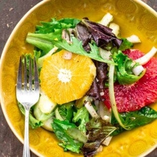 dressed fresh salad in a bowl