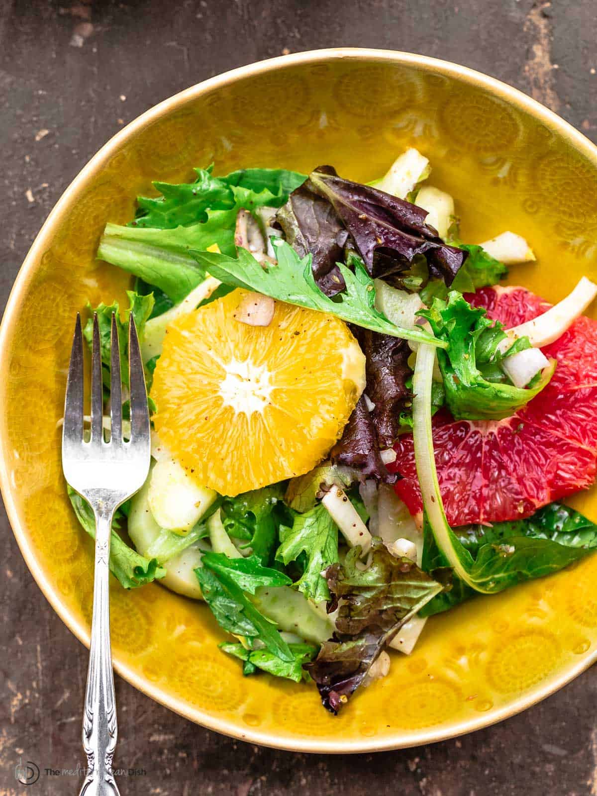 dressed fresh salad in a bowl