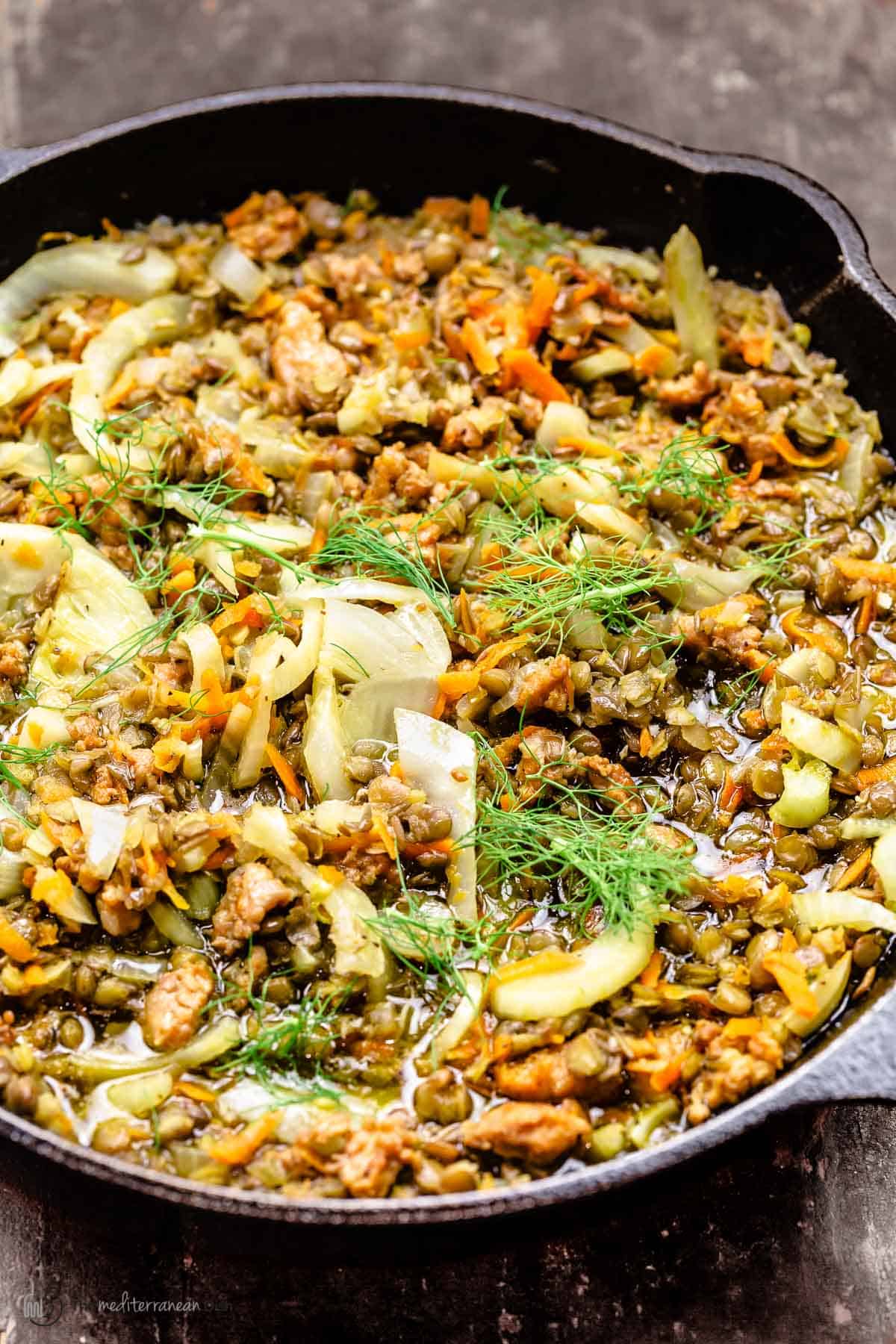 lentil stew topped with fennel fronds