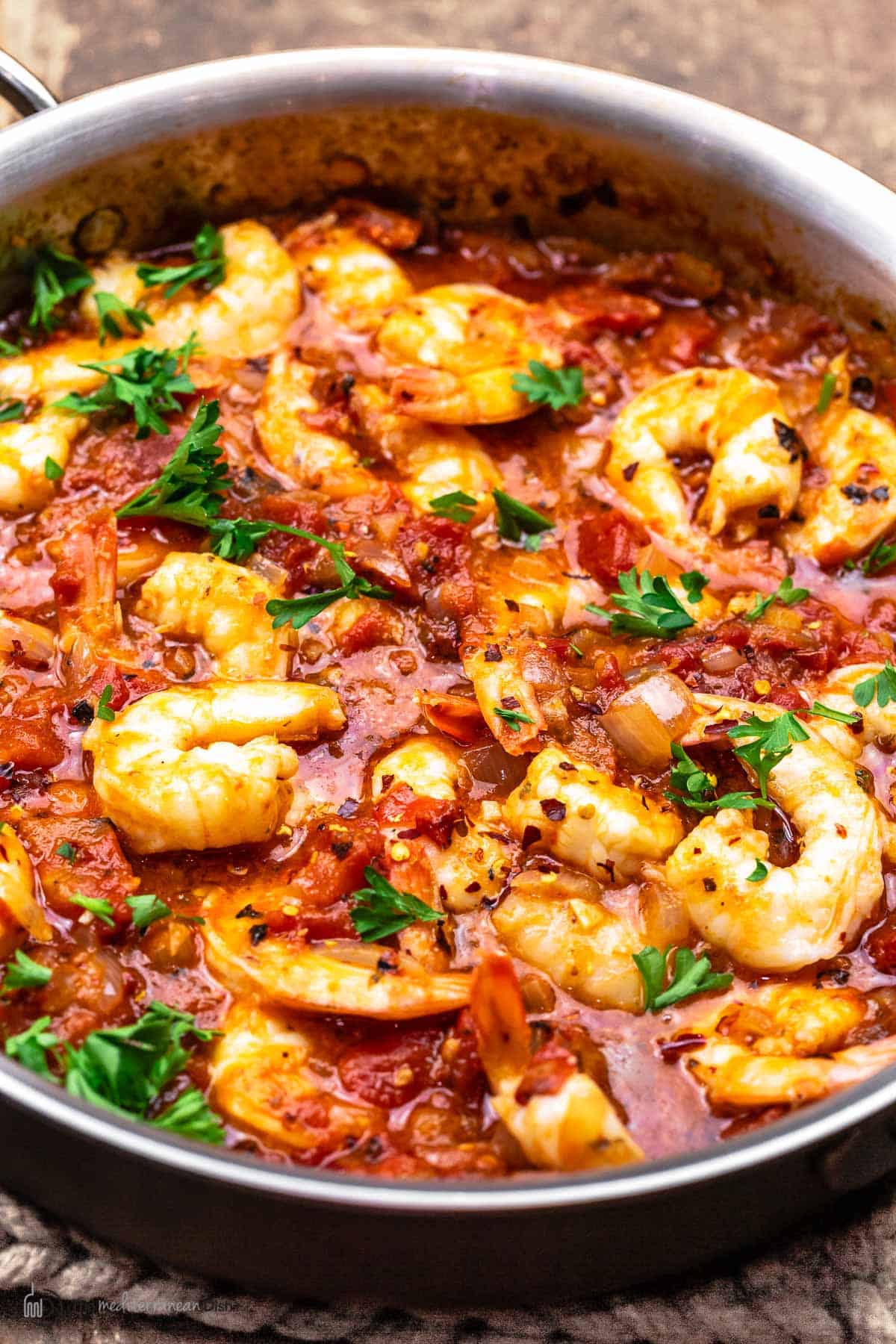 close up of shrimp fra diavolo with parsley garnish