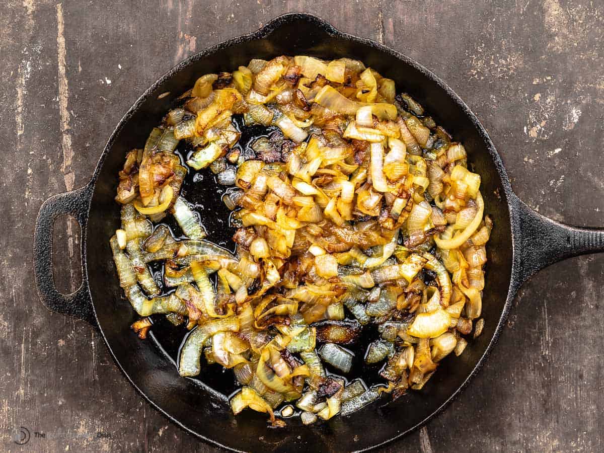 caramelized yellow onions in a cast iron skillet