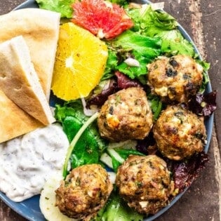 meatballs with citrus salad, pita, and yogurt dip