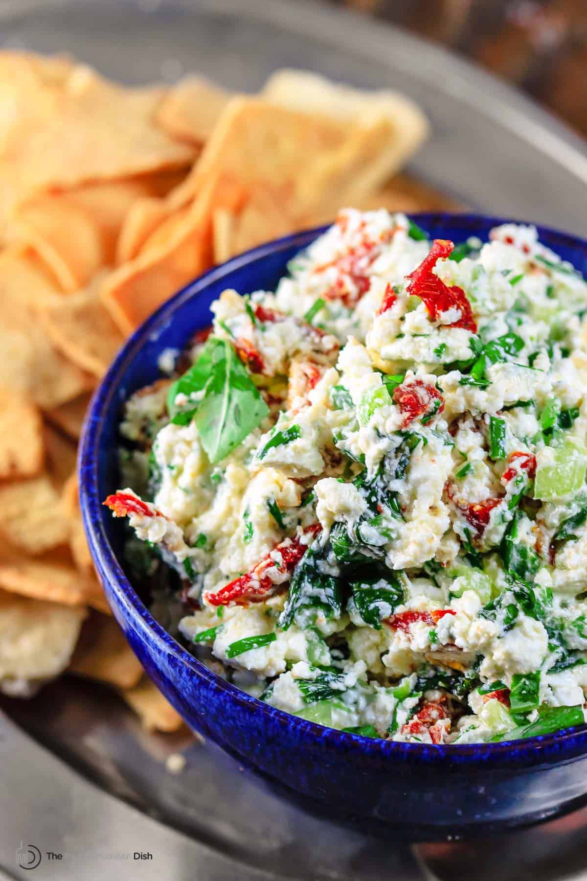 feta dip served with crackers and pita chips