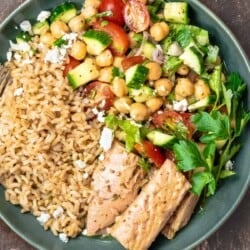 One rice bowl with tuna and Mediterranean salad with chickpeas, tomatoes, and cucumbers