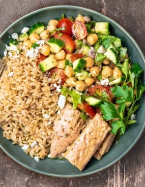 One rice bowl with tuna and Mediterranean salad with chickpeas, tomatoes, and cucumbers