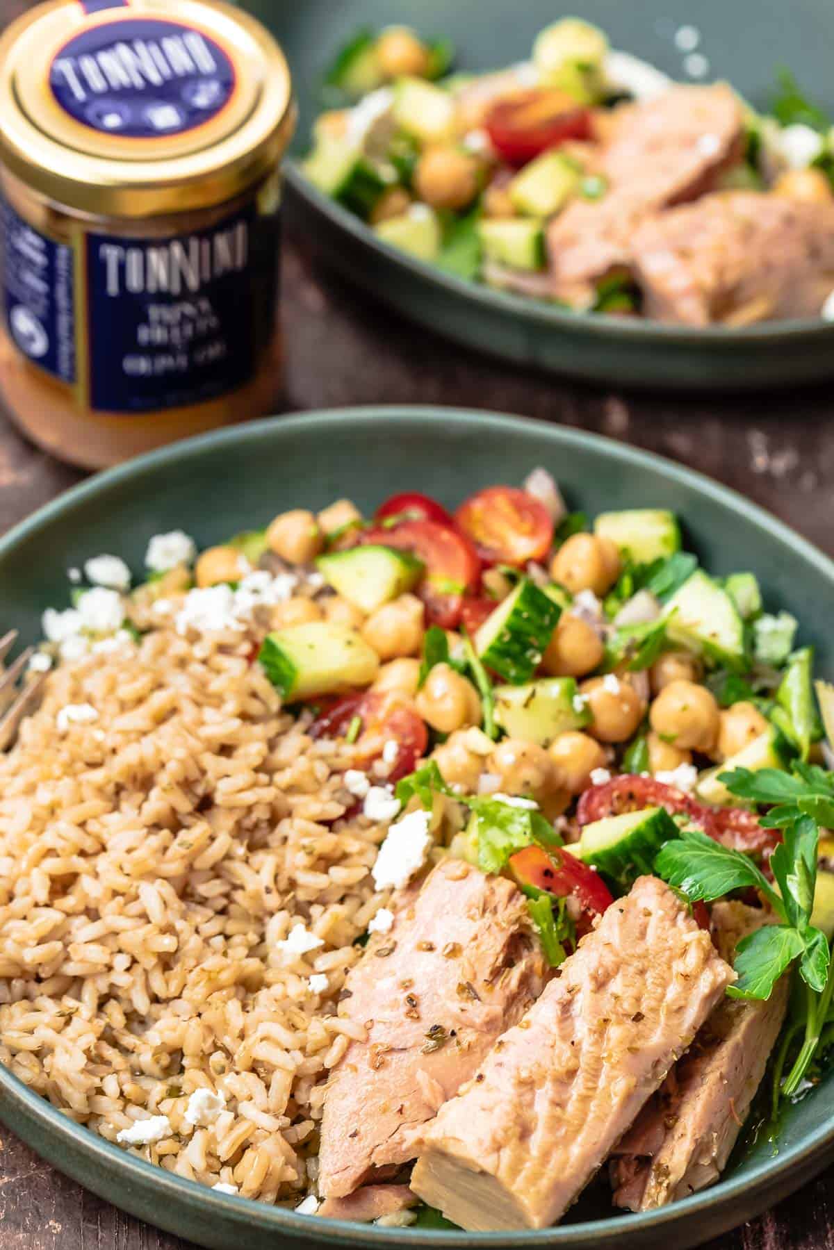 Two rice tuna bowls with a jar of Tonnino Tuna displayed