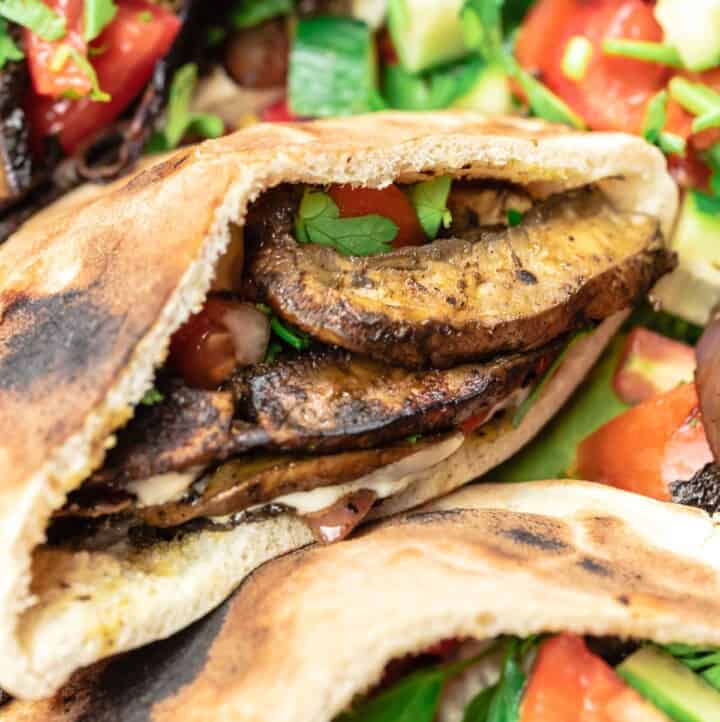 mushroom shawarma in pita bread served with Mediterranean salad