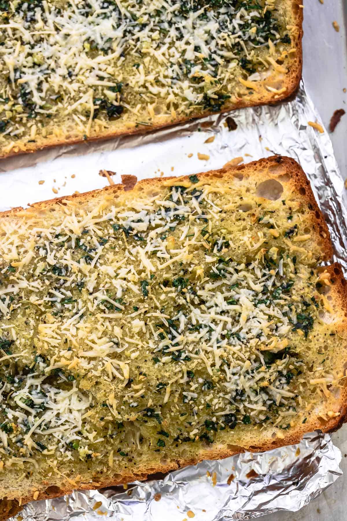 garlic bread on a foil-covered sheet pan