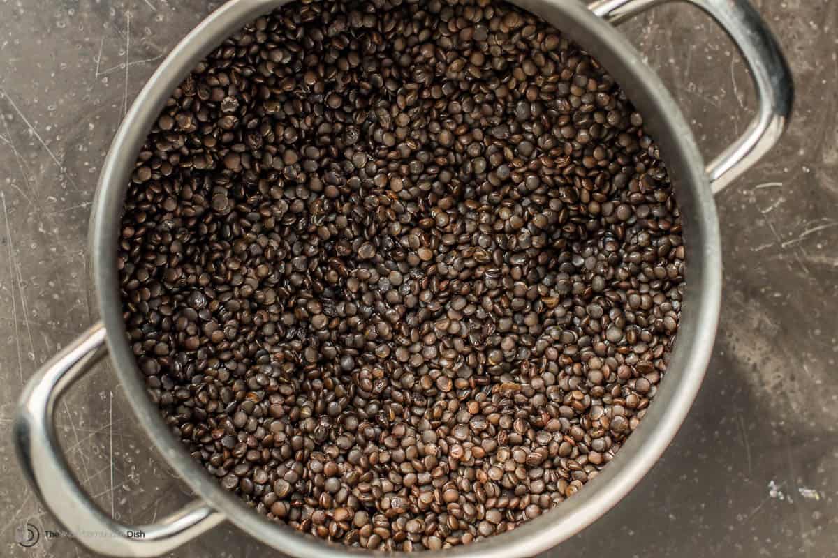 A pot of par cooked lentils