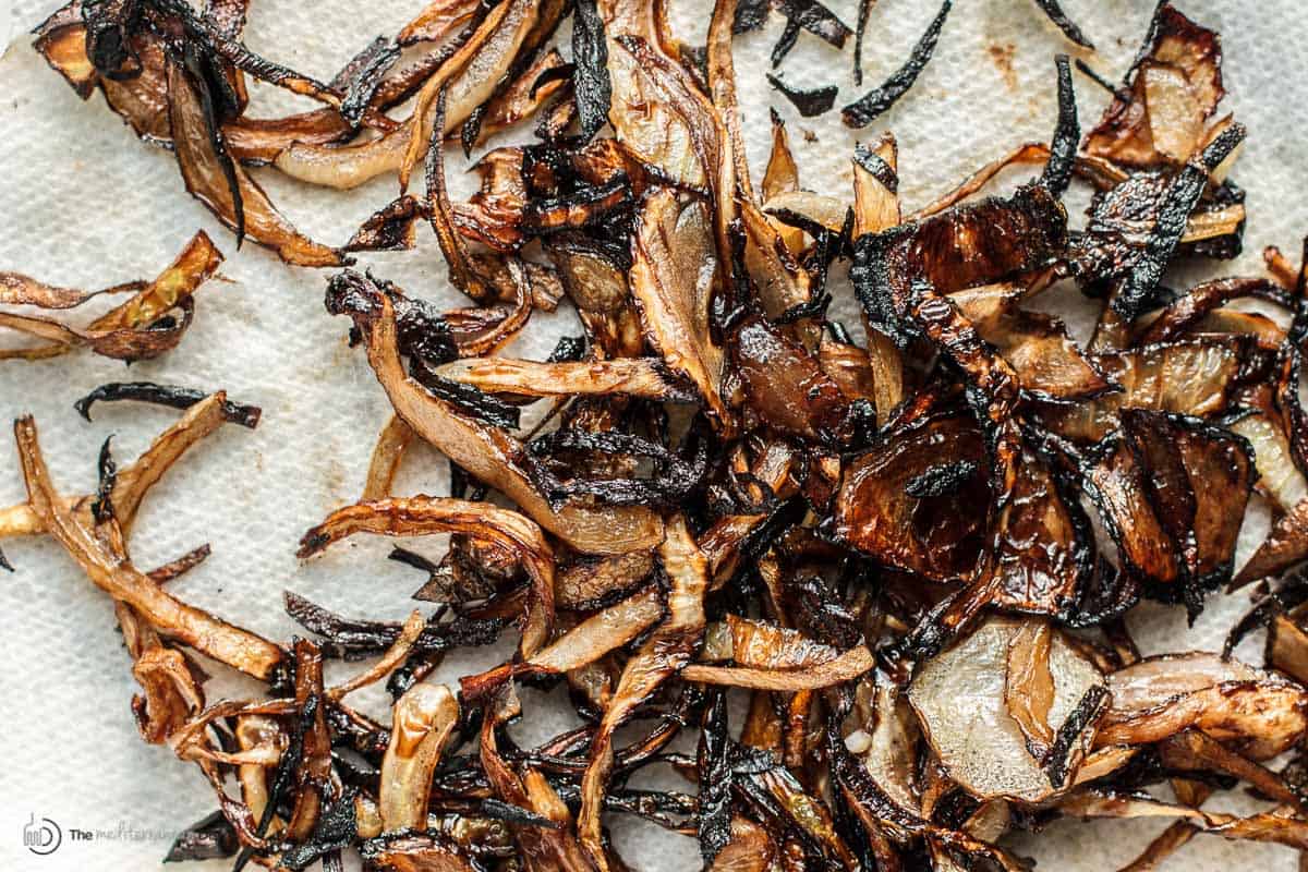 Fried onions on a paper towel