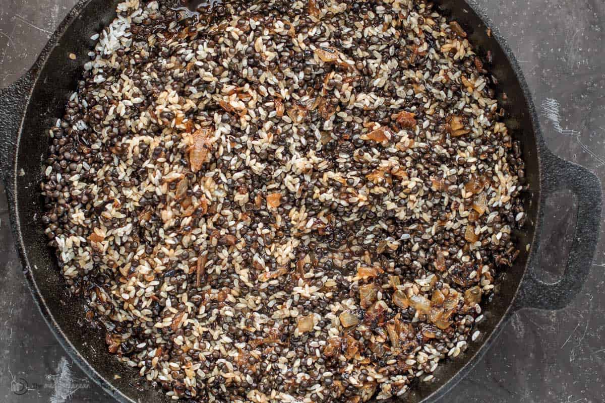 A pot of cooked lentils and rice