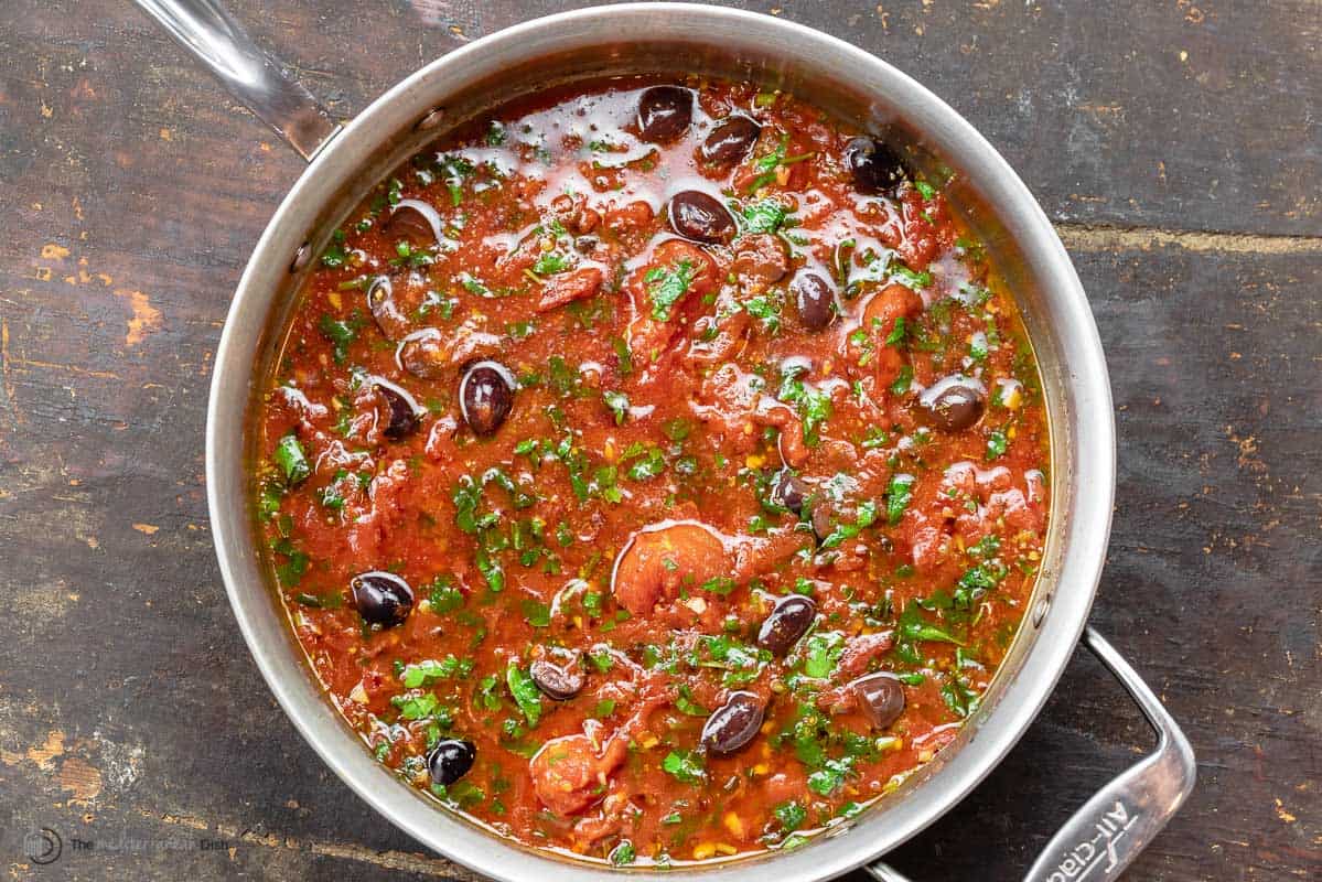 tomato-based puttanesca sauce with olives and fresh herbs