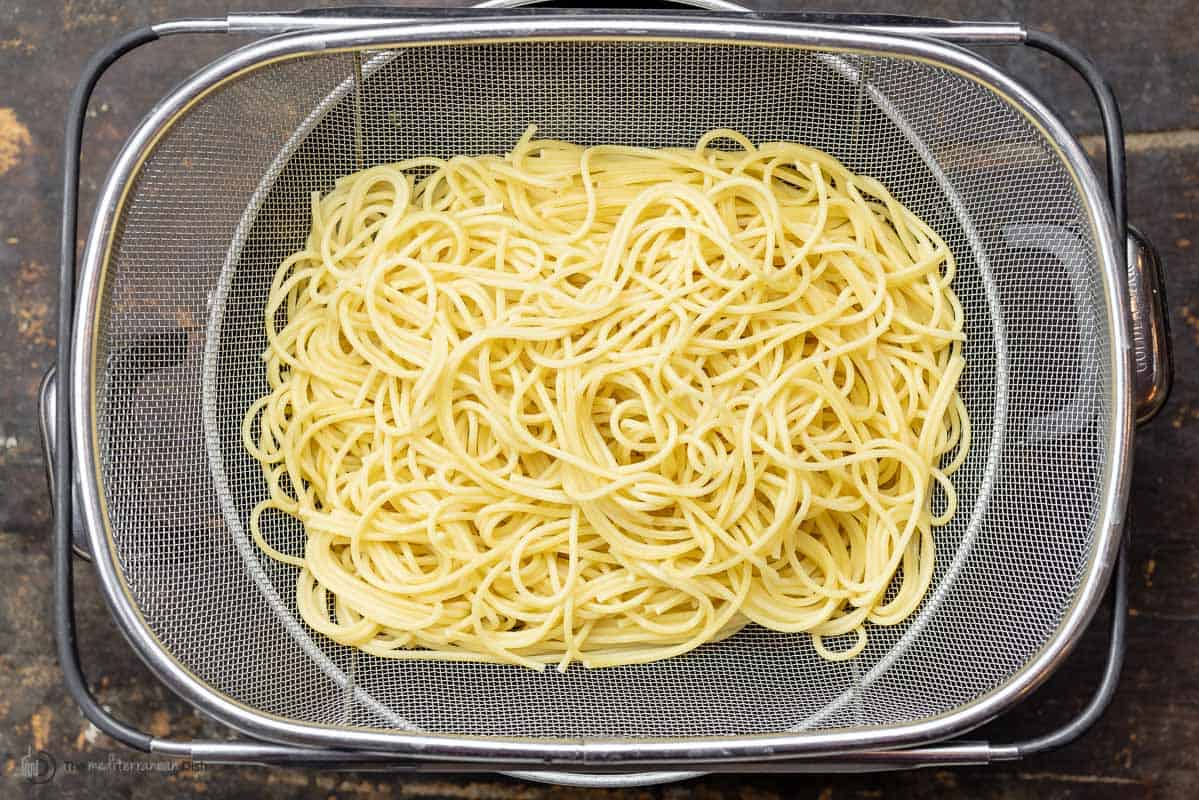 spaghetti in a colander