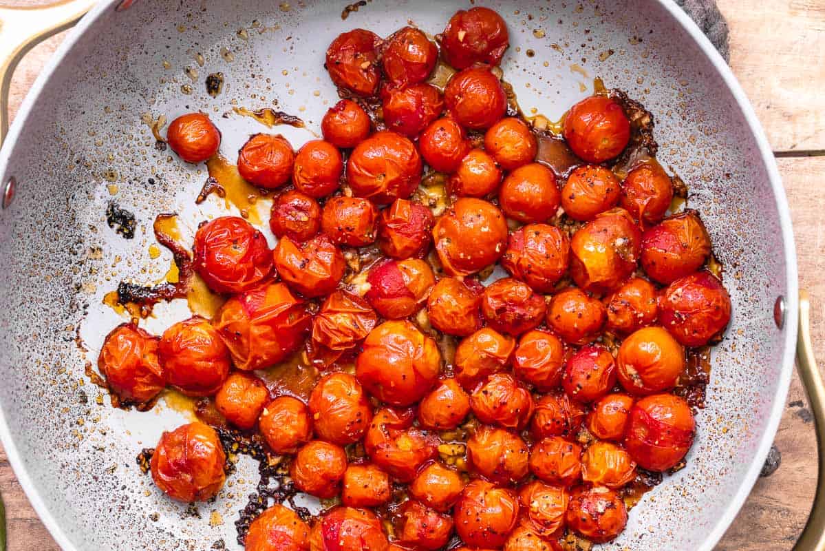 blistered tomatoes in a skillet