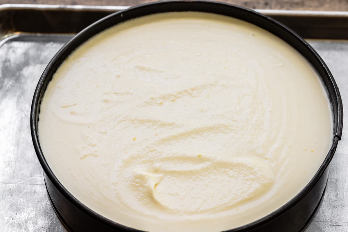 batter for ricotta cheesecake in a springform pan